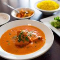 Chicken Tikka Masala · Boneless white meat chicken baked in the tandoor enveloped in our homemade buttery cream sau...