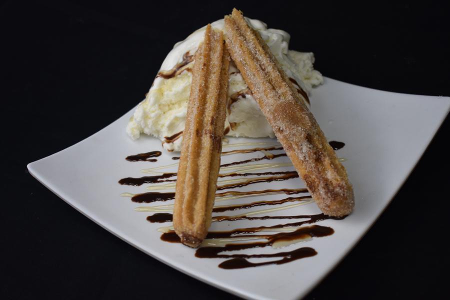 Churro · Fried pastry dusted with cinnamon sugar.