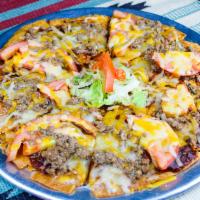 Deluxe with Ground Beef · Crispy tortilla with melted cheese, New Mexican red chile, tomatoes and ground beef. Spicy.