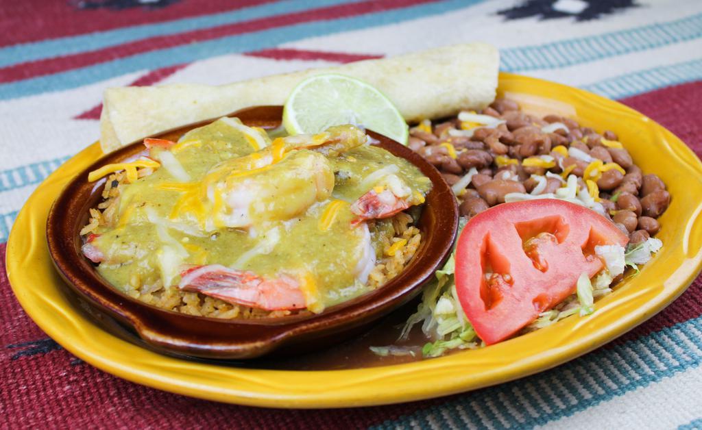 H. Shrimp Fundido · Shrimp smothered with queso fundido, green chile sauce over a bed of rice, served with beans and your choice of homemade flour or corn tortillas. Spicy New Mexican chile.