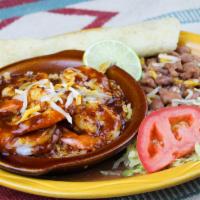 Shrimp Veracruz · Large shrimp in New Mexican red chile served over rice with a side of beans and a homemade f...