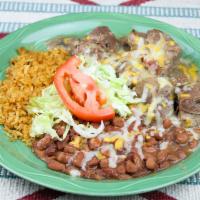 Carnitas · Pork slow cooked in a Dutch oven until tender and flavorful. Topped with cheese, served with...