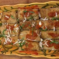 Eggplant Rollatini Entree · (2) Large breaded eggplant rolls stuffed with herbs & fresh ricotta cheese smothered with ma...