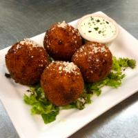 Arancini · Hand-rolled risotto balls stuffed with our house-made mozzarella and crisp pancetta. Served ...