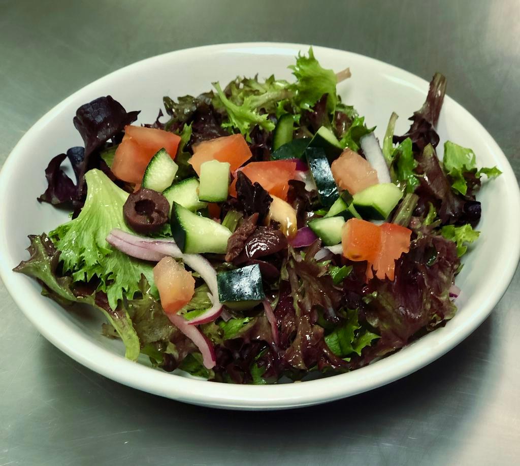 House Salad · Field greens tossed with diced tomatoes, red onions, cucumbers and Kalamata olives. Served with your choice of dressing.