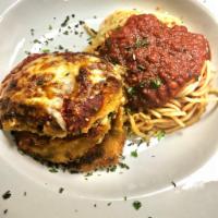 Eggplant Napoleon · Slices of eggplant layered with fresh mozzarella, roasted red peppers and basil. Served with...
