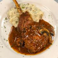 Veal Chop · 16 oz Bone-In Veal Chop served with sauteed mushrooms & roasted garlic mashed potatoes. Fini...