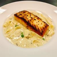 Pan-Roasted Salmon · Seared and roasted salmon with peas and truffle cream. Served with pappardelle and a house s...