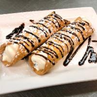 Cannoli · 2 cannoli filled with cream and chocolate chips.
