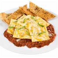 Baked Meat Ravioli · With your choice of sauce. Includes a personal garlic bread.