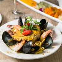 Seafood Linguini · Seafood linguini with white wine saffron sauce, dressed with scallop, mussels, white meat, f...
