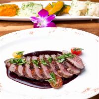 Duck Magret Cranberry Sauce · Signature. Seared moulard duck breast with Michigan's cranberry glaze. Gluten-free.