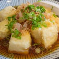 Agedashi Tofu · Fried tofu top with bonito flakes served with tempura sauce.