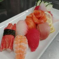 Nigiri and Sashimi Mix · 6 pieces of nigiri and 7 pieces of sashimi. Served with salad.