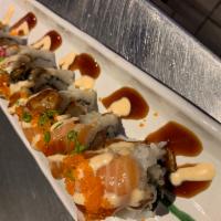 Golden Trio Roll · Salmon, tuna, crab salad, tempura shrimp top with tuna, salmon, unagi, scallion and masago. ...