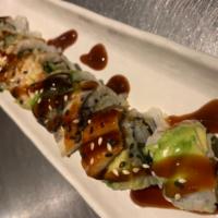 Dragon Roll · Tempura shrimp, cucumber top with unagi, avocado and sesame seeds. Teriyaki.