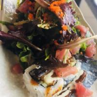 Mari Roll Roll · Crab salad, tempura shrimp, cucumber top with spring mix, seared tuna, avocado, walkame, mas...