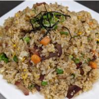 Fried Rice · Stir-fried rice with pea, carrots, onions and choice of meat.