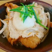 Katsu-Egg Don · Deep fried chicken katsu, over easy egg, onion and carrot. Cooked in a buttery shoyu, over r...