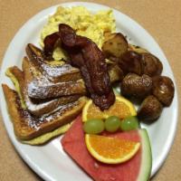 House Special · 2 eggs any style, 2 buttermilk pancakes or French toast, side of bacon or sausage, roasted p...