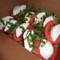 Caprese Salad · Whole size only. Fresh mozzarella, tomatoes, fresh basil and homemade Italian dressing. Vege...