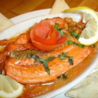 Salmone alla Romana · Wild sustainable Sockeye salmon baked with diced tomatoes, fresh garlic, basil, capers and o...