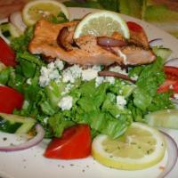 Insalata di Salmone · Oven roasted wild, sustainable Sockeye salmon, served over green salad, tomatoes, cucumbers,...