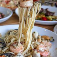 Lunguini Tutto Mare · Mussels, shrimp, scallops, calamari, baby clams sauteed in white wine, garlic, and butter.