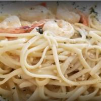 Shrimp ala Palmero · Classic shrimp dish with butter, lemon, wine, and fresh garlic served over angel hair pasta.