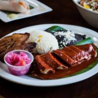Pollo Yucateco Dinner · Chicken breast marinated with axiote citrus sauce served with rice, blackbeans, and sweet pl...