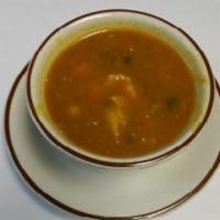 Chicken Soup · Indian soup made with chicken stock, onions, tomatoes, and green peas.