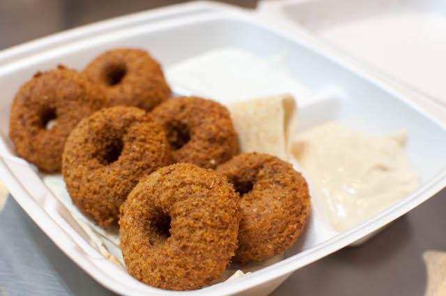 Falafel 6PC · 6 pieces. Made from ground chickpeas, garlic, and vegetables with our traditional organic spices, fried in pure vegetable oil. served with hummus, tzatziki, and Syrian bread only. Add fixings for an additional charge.