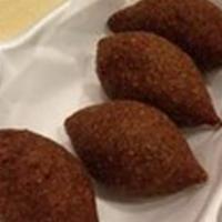Kibbeh (4) (Halal حلال) · 4 pieces. Football shaped shell made of bulgur (cracked wheat) and lean sirloin pate stuffed...