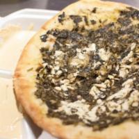Spinach & Feta Pie · Grilled flatbread pizza topped with seasoned cooked spinach, feta cheese, diced onions, and ...