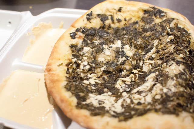 Spinach & Feta Pie · Grilled flatbread pizza topped with seasoned cooked spinach, feta cheese, diced onions, and lemon juice.