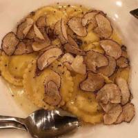 Ravioli Piccolo Sogno · 4 cheese ravioli, pine nuts, butter, Marsala glaze, and Parmesan curls. 