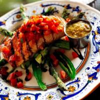 Salmon Alfresco · Pan seared wild caught salmon served with tomato topping, grilled asparagus and balsamic gla...