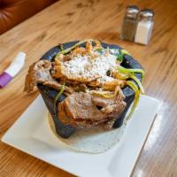 Molcajete Azteca · A traditional freast. A hot volcanic stone bowl with a skillet filled with a juicy rib eye s...