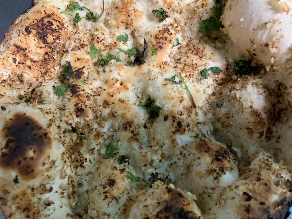 Garlic Naan · Naan flavored with garlic.