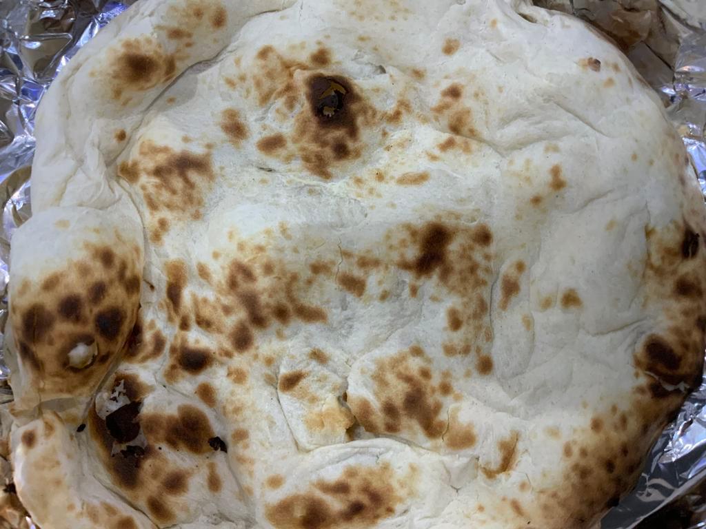  Naan · Flat bread baked in clay oven.