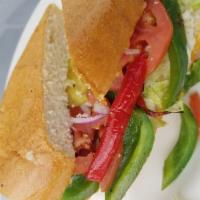 Sandwich de Vegetales  · Veggie sandwich with onions, lettuce, tomato, peppers, butter, and mayo. With a slight bit o...