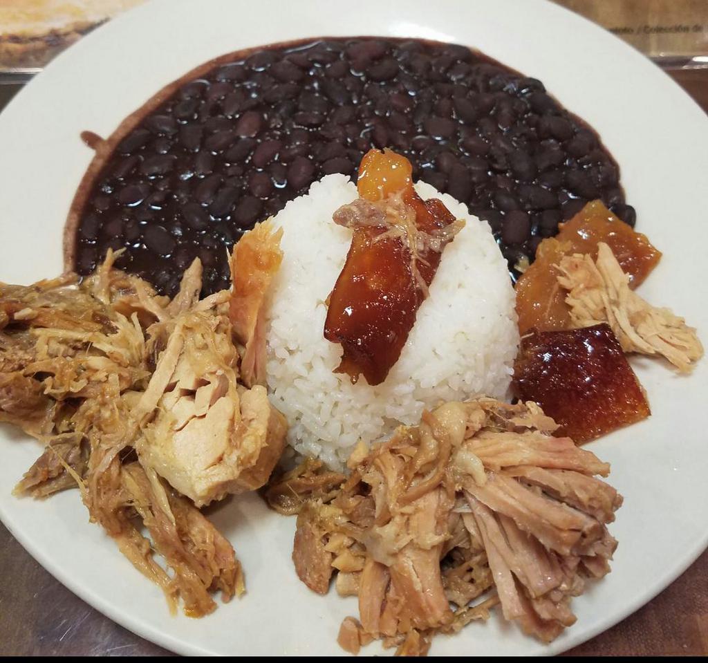 Lechon Asado  · Roast pulled pork with Cuban seasonings. Served with choice of 2 sides.