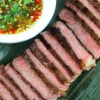 21. Crying Tiger Beef · grilled ribeye served with spicy sauce
Extra sauce is $.50 Please add as separate line item