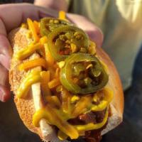 The Double Wide Dog Sliders · All beef slider dog, Texas chili, cheddar, pickled jalapenos, yellow mustard.