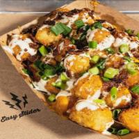 Loaded Tots · Bacon, green onion, cheddar. Topped with homemade ranch.