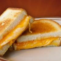 Gourmet Grilled Cheese · Cheddar, American, and Swiss cheeses melted on sourdough bread with our special Parmesan and...