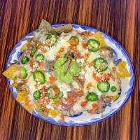 Vegan Nachos · House tortilla chips topped with vegan cheese, black beans, pico de
gallo, vegan sour cream ...