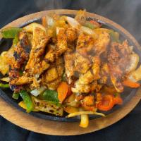 Grilled Chicken Fajita · Fajitas Are Served Over A Bed Of Fresh Cut Grilled Peppers & Onions On A Sizzling Skillet Wi...