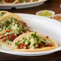 Regular Taco · Choice of meat with cilantro and onions.