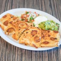 Quesadilla Suiza · You choice of meat with a side of sour cream, pico de gallo and guacamole.